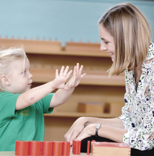 child-shwoing-hands-to-teacher